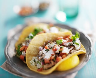 Authentic Mexican carnitas tacos plate