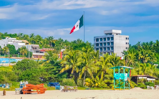 Beautiful Natural Panorama View With Surfer Waves Palm Trees And Blue Sky On The Beach