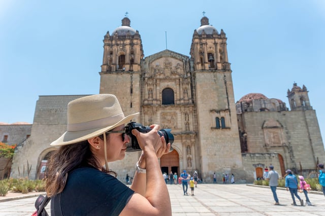 Woman Taking Pictures In Oaxaca City