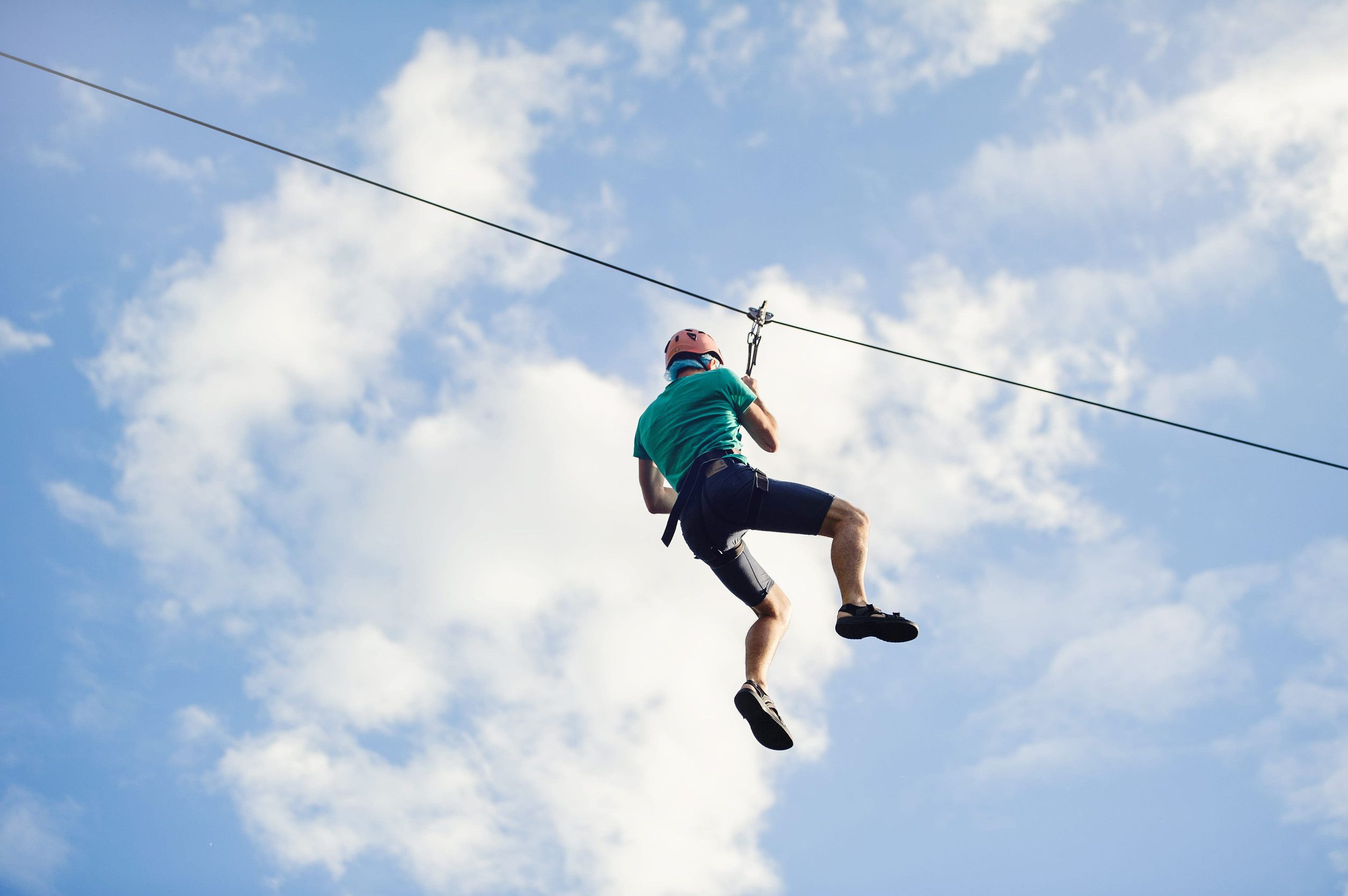 A Man Engaged In Ziplining