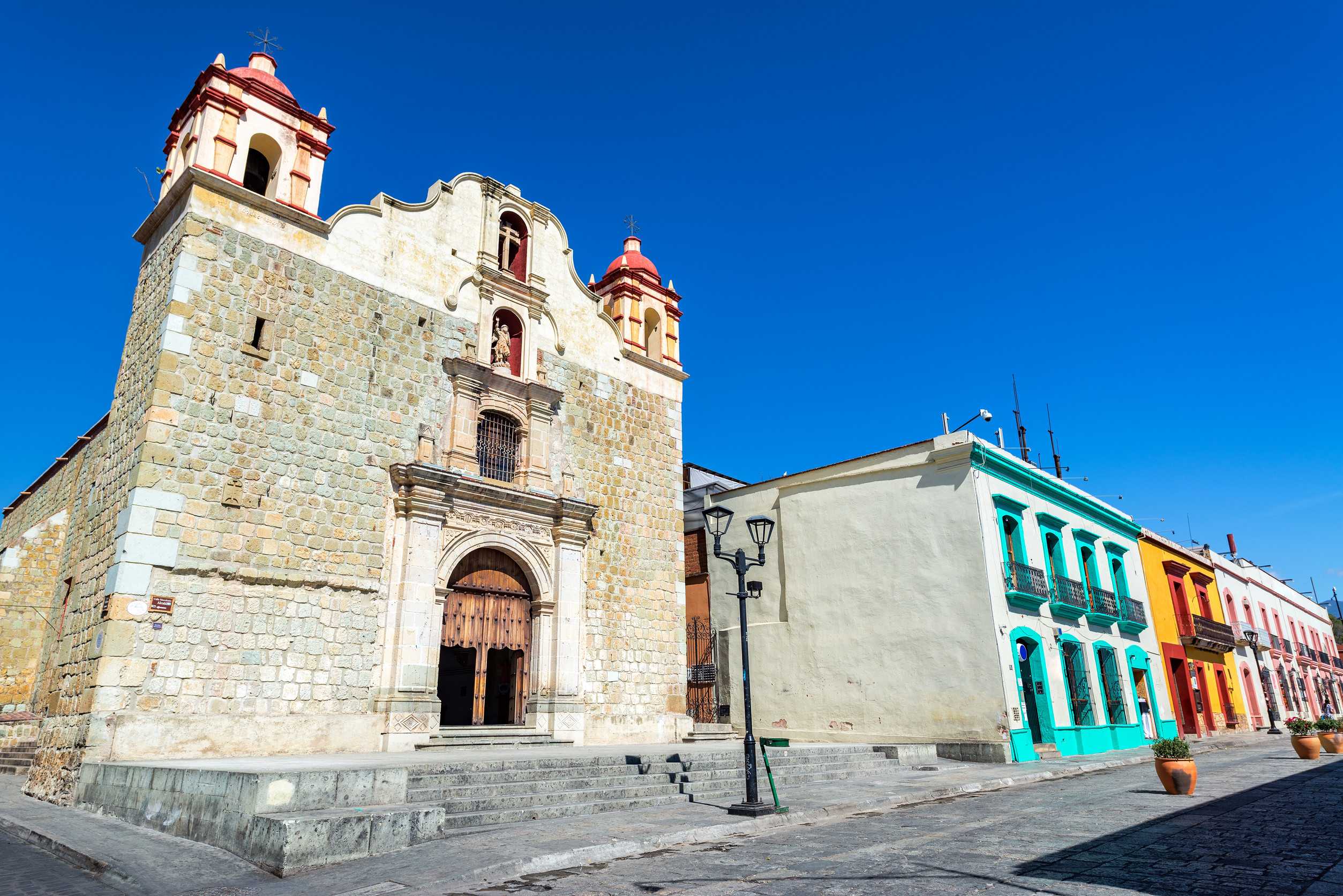 Historic church and colourful street in Mexico Historic church and colourful street in Mexico