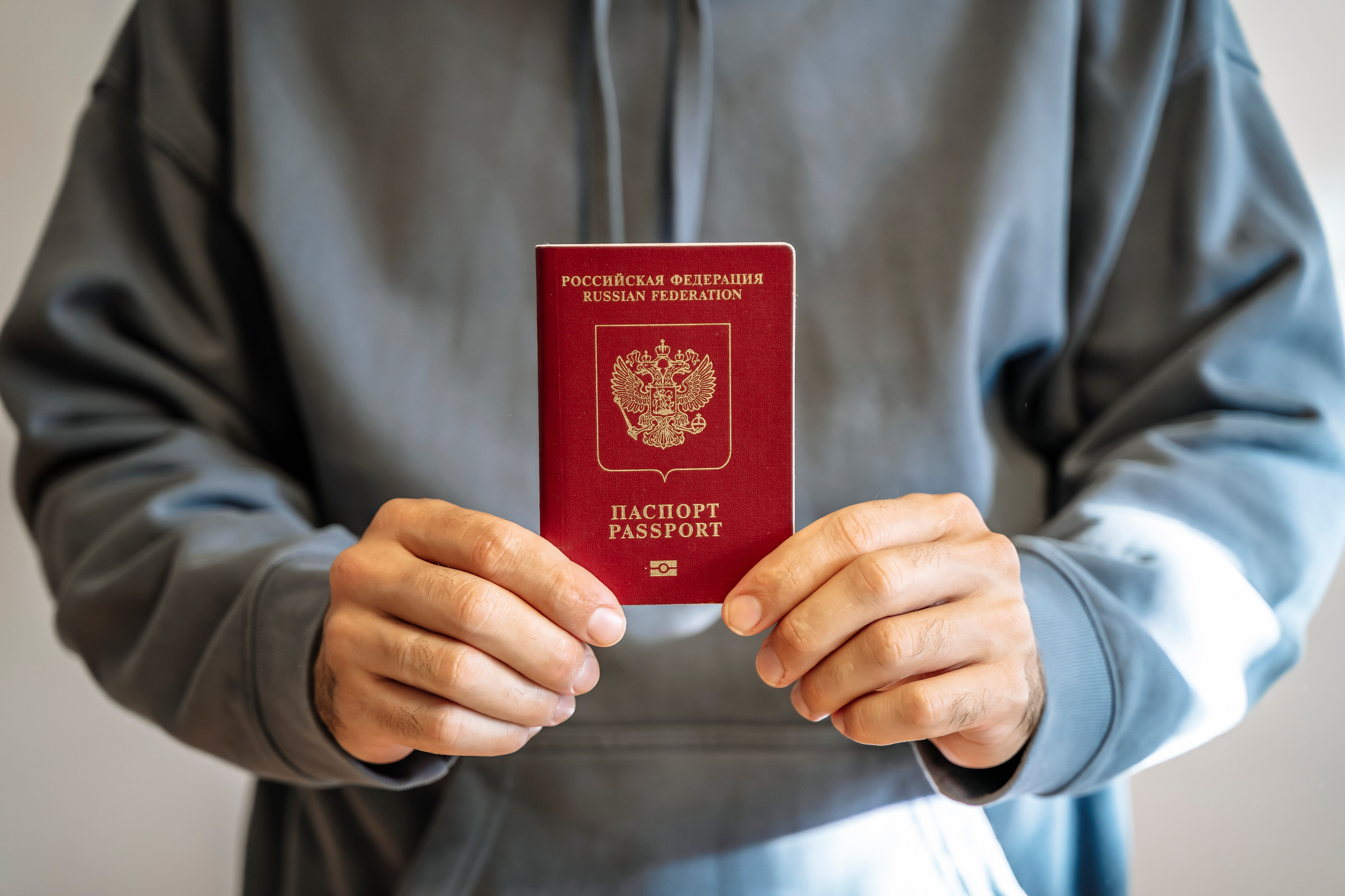 Russian Passport In The Hands Of A Man Russian Passport In The Hands Of A Man