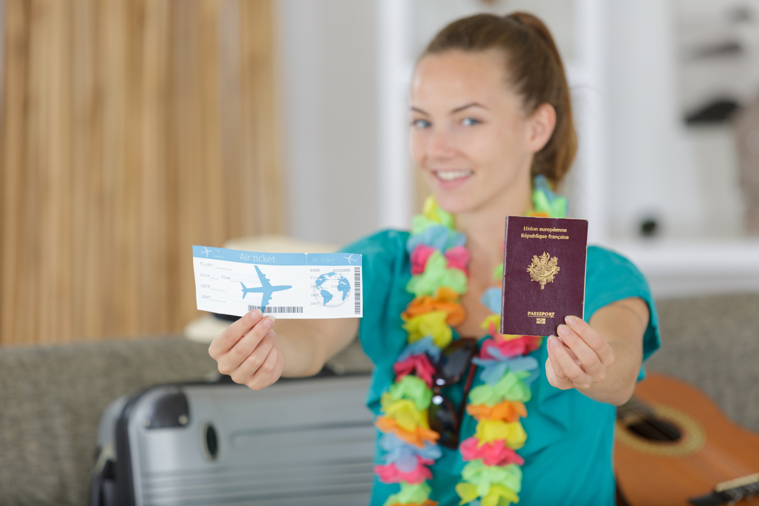 Young Woman Showing Boarding Pass And Passport Young Woman Showing Boarding Pass And Passport