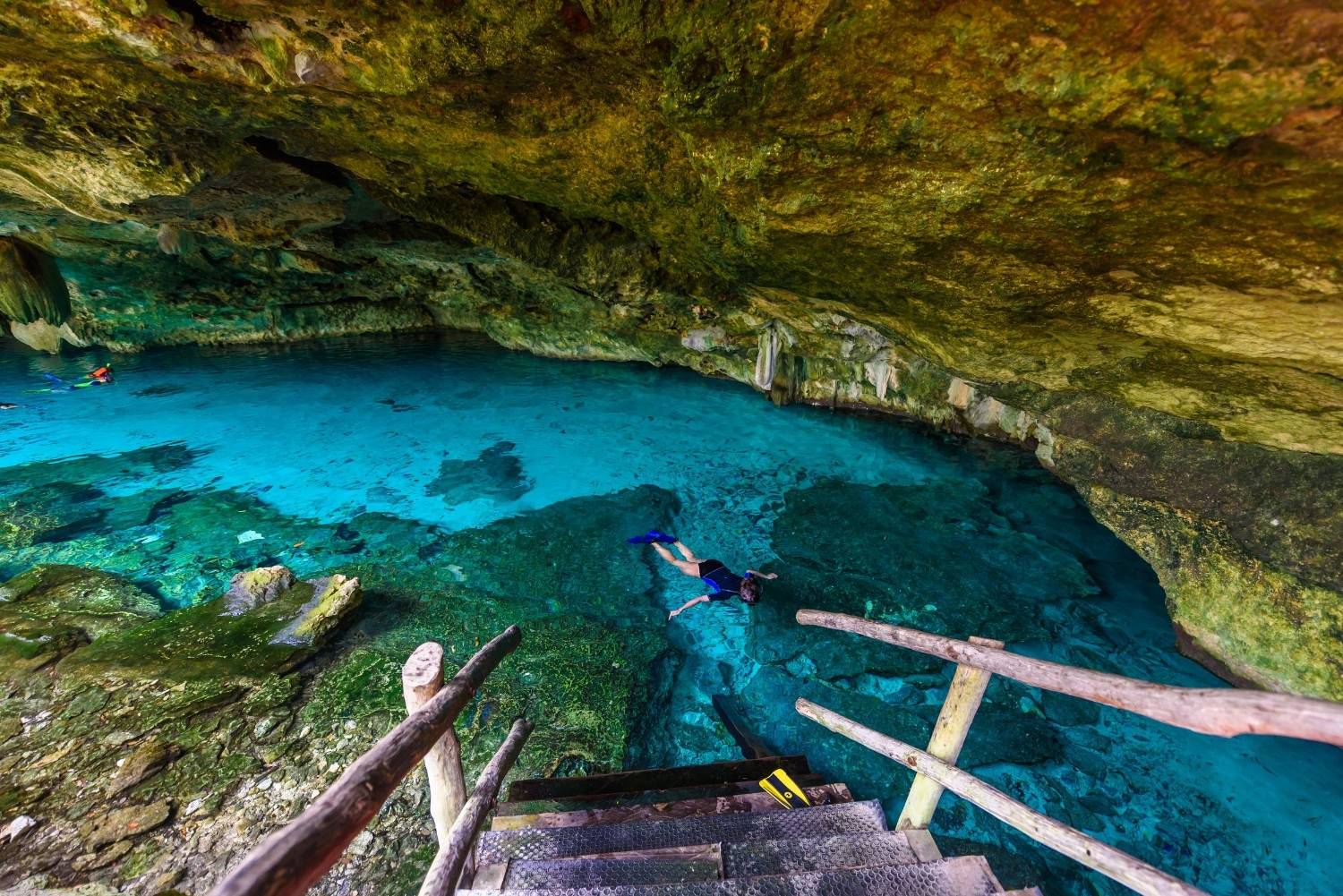 People swimming and snorkelling in Cenote Dos Ojos